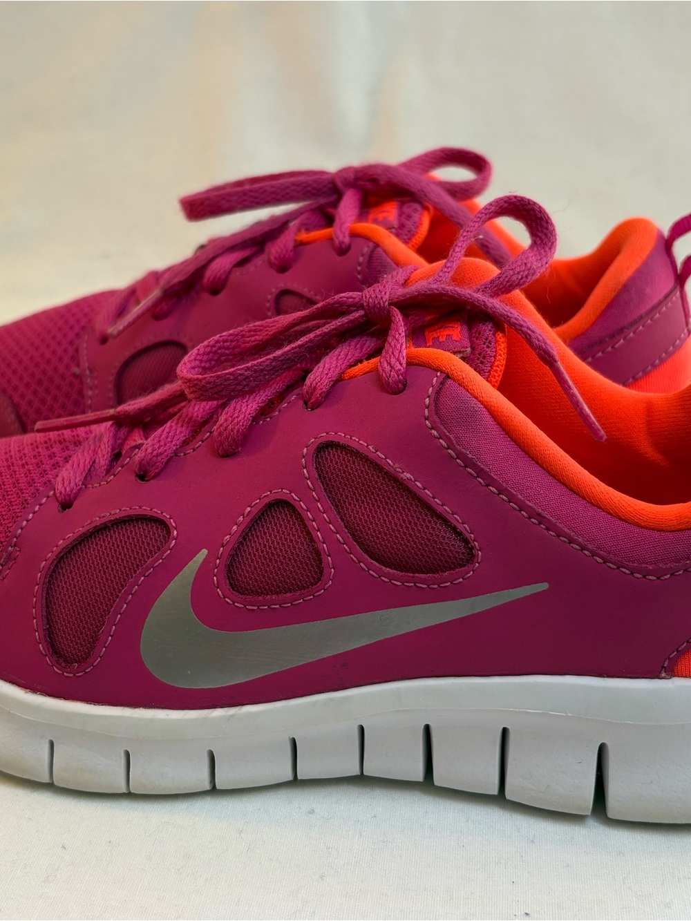 Nike Kids Pink Sneakers with Orange Lining and Silver Swoosh